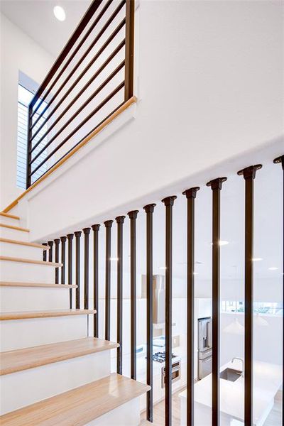 Staircase featuring hardwood / wood-style floors