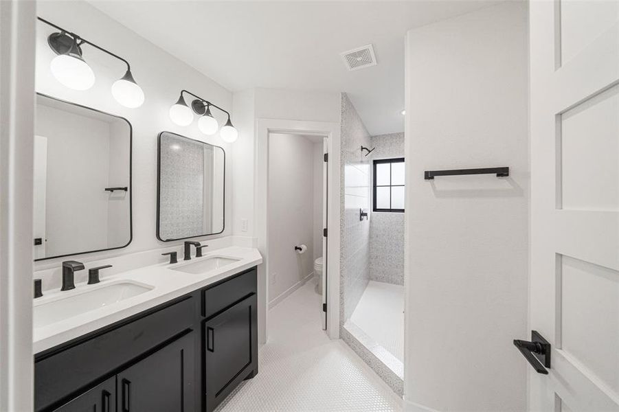 Bathroom 2 with double sinks and big shower