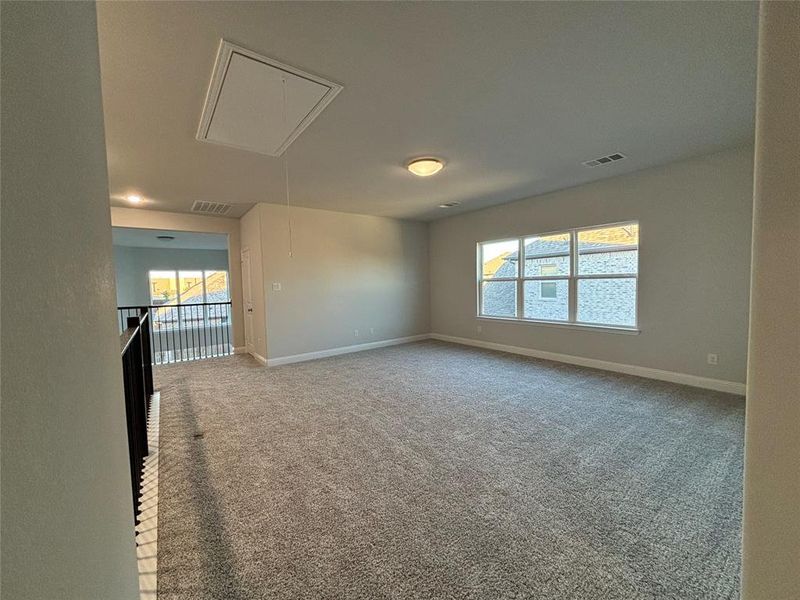 Spare room featuring carpet flooring