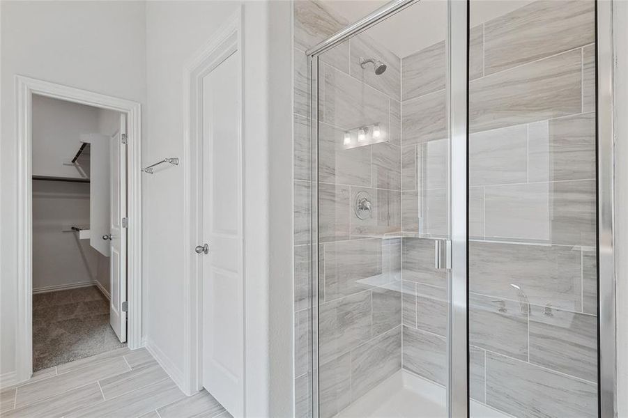 Bathroom featuring a shower with shower door