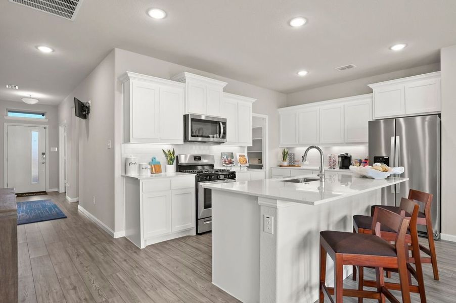 Kitchen in the Masters home plan by Trophy Signature Homes – REPRESENTATIVE PHOTO