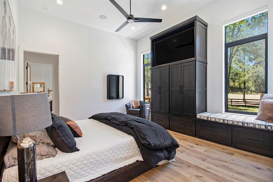 View of the gorgeous built-ins and reading bench in this secondary bedroom.