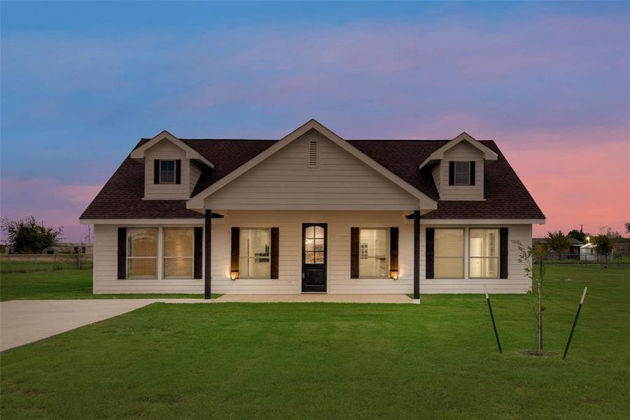 View of front of home featuring a lawn