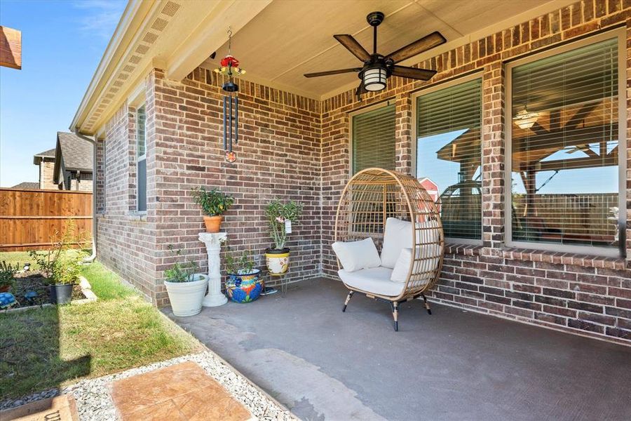 View of patio featuring ceiling fan