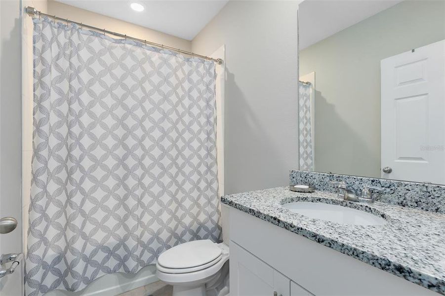 Bathroom 2-Located on 2nd floor. Features tub/shower combination, granite top vanity.