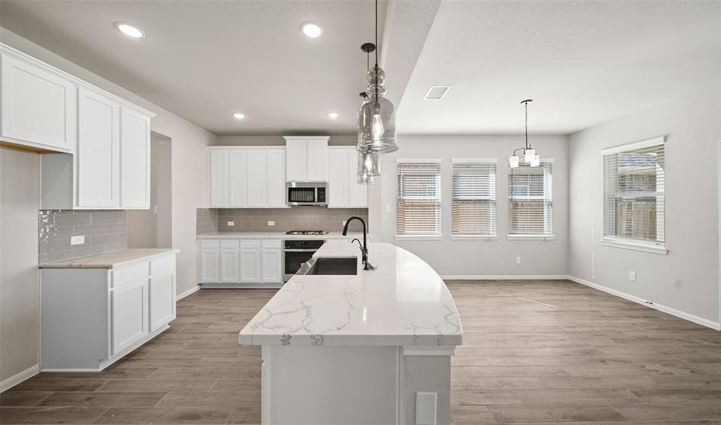 View of kitchen and dining area (*Photo not of actual home and used for illustration purposes only.)