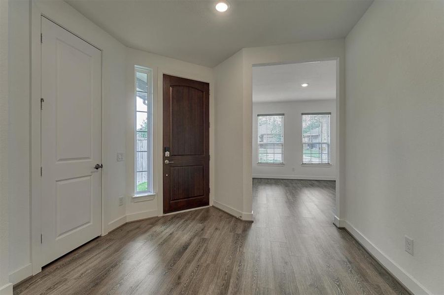 Quaint foyer to greet family and guests. Note the desirable flex room to the left of the entry way.