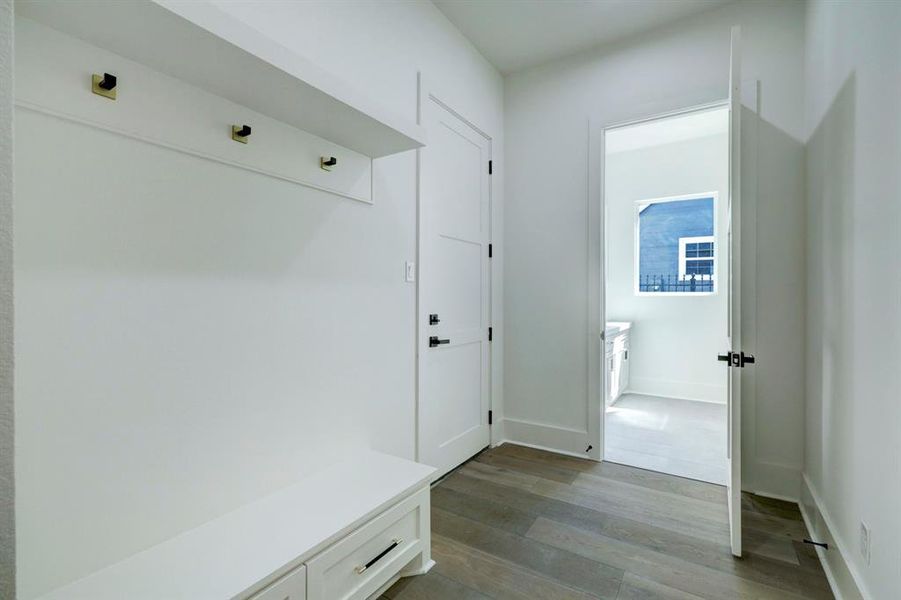 Mudroom w/ garage access and laundry room behind