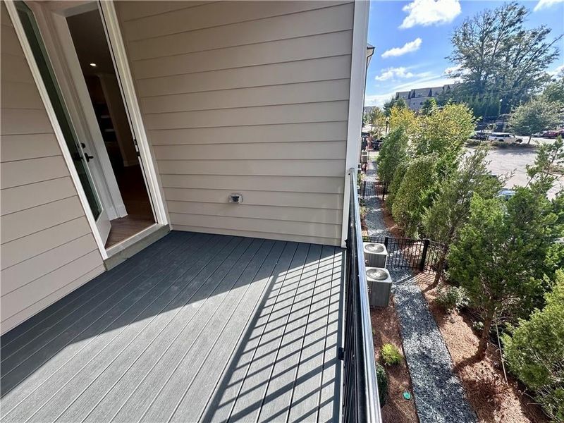 Rear deck access provides views of the backyard, which is fenced in and maintained by your HOA