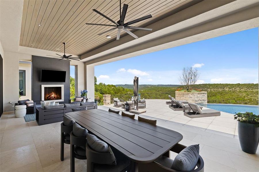 Dine in style on the covered patio, complete with a fireplace and an outdoor kitchen, allowing you to savor culinary delights while enjoying the fresh air and sunshine.