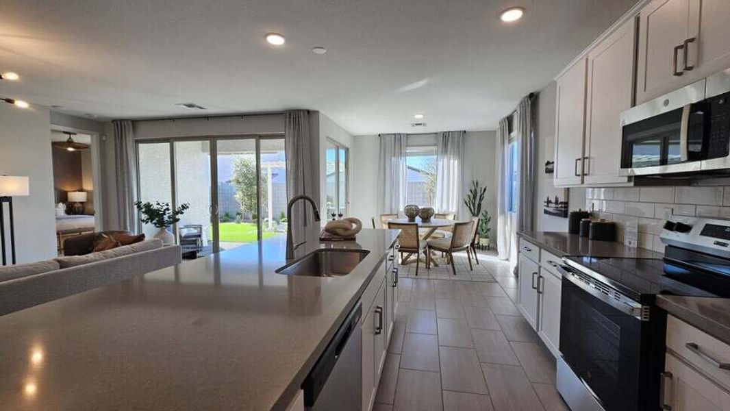 Kitchen and dining nook - Model Home - Furniture not included