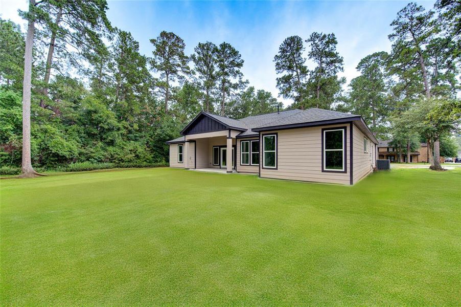 Rear view of home, grass is simualted