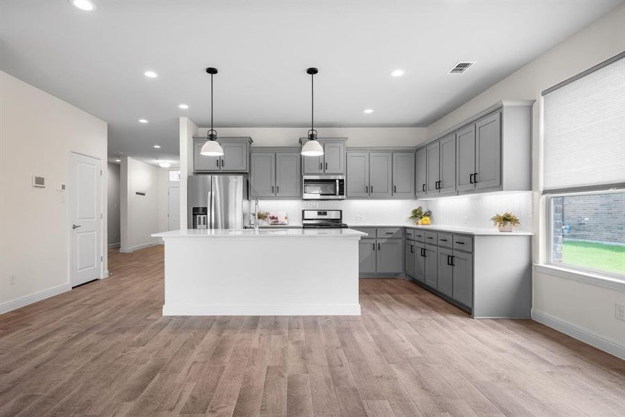 Modern kitchen featuring sleek countertops!