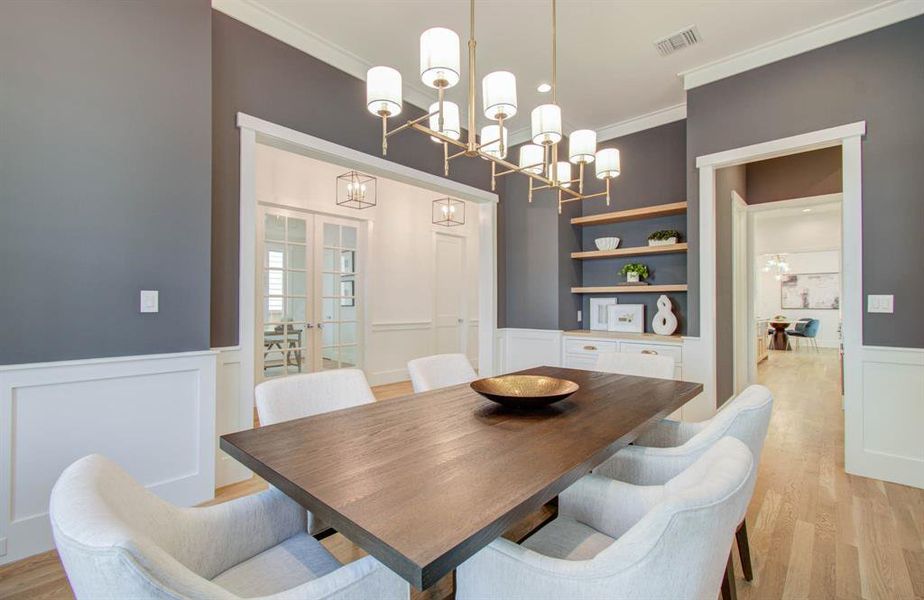 Another view of the dining room. note the floating shelves and entry way to the butler's pantry.