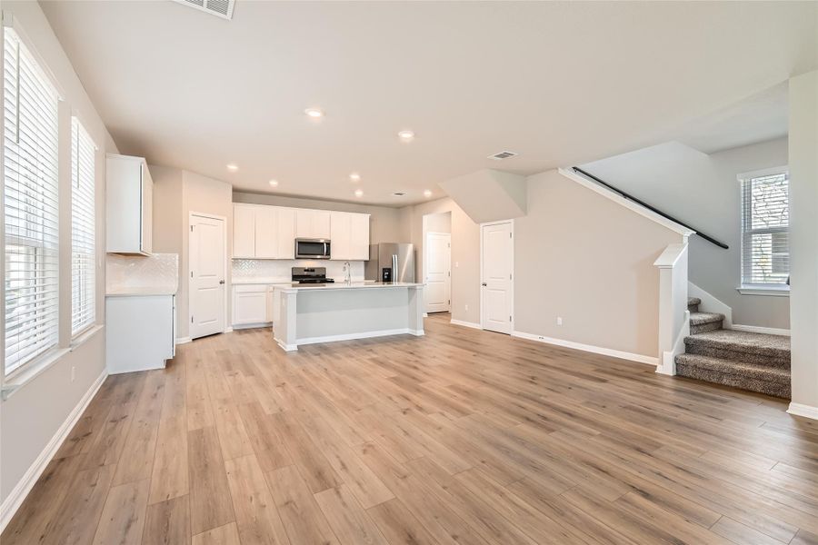 The bright and open floor plan makes it easy to stay connected with friends and family throughout the main living area.