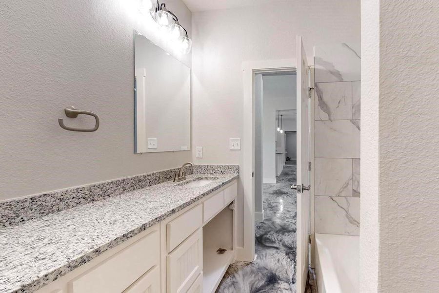 Bathroom featuring vanity and tile patterned floors