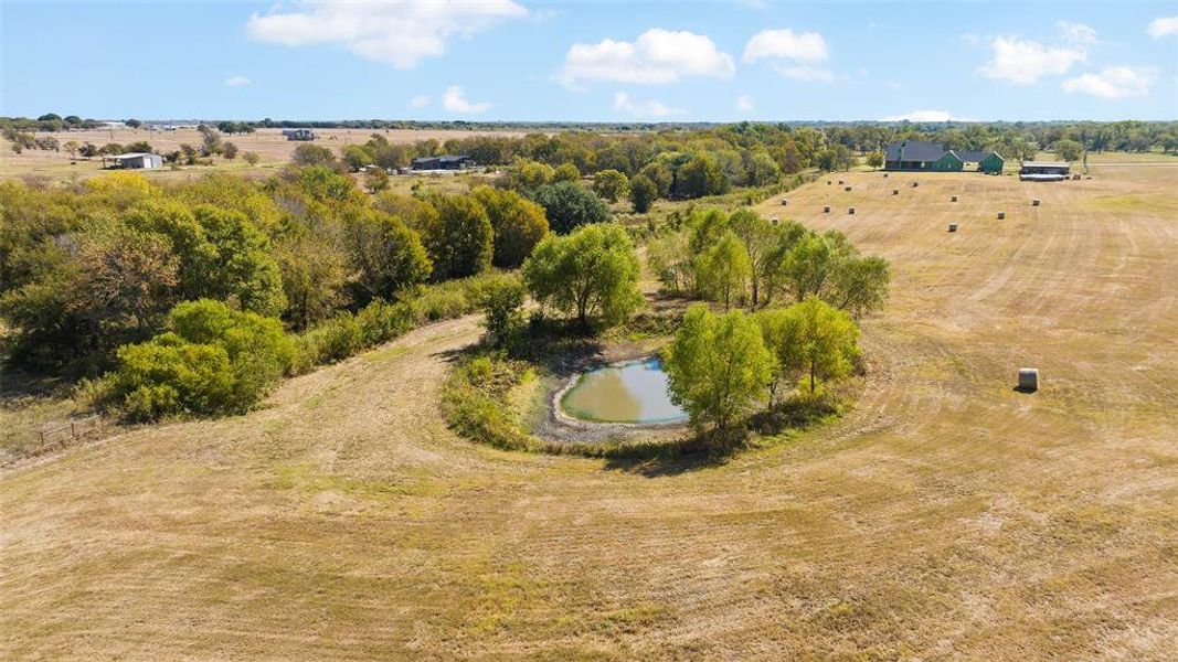 Drone / aerial view featuring a water view and a rural view