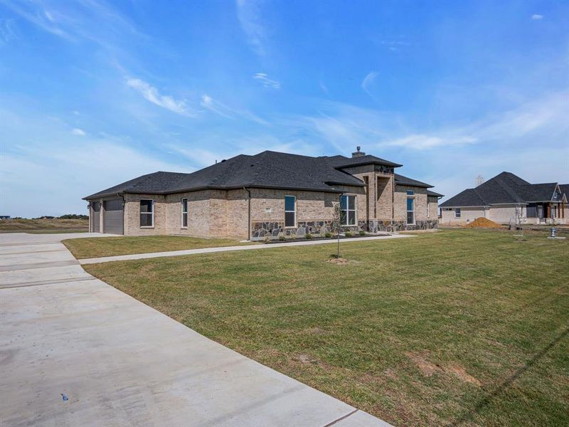 Prairie-style house with a front yard and a garage