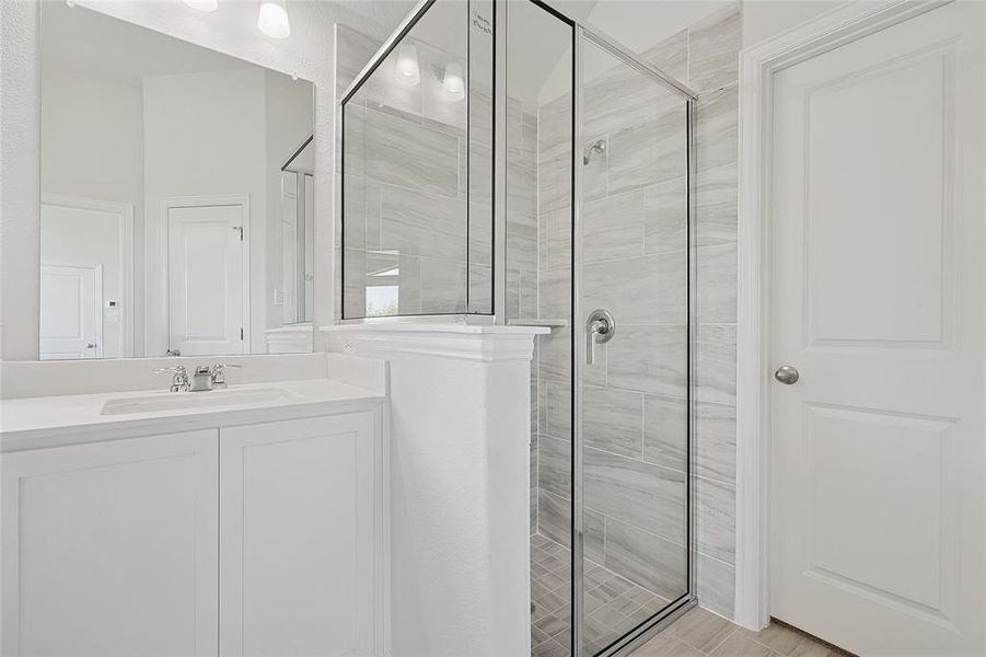 Bathroom with vanity and walk in shower