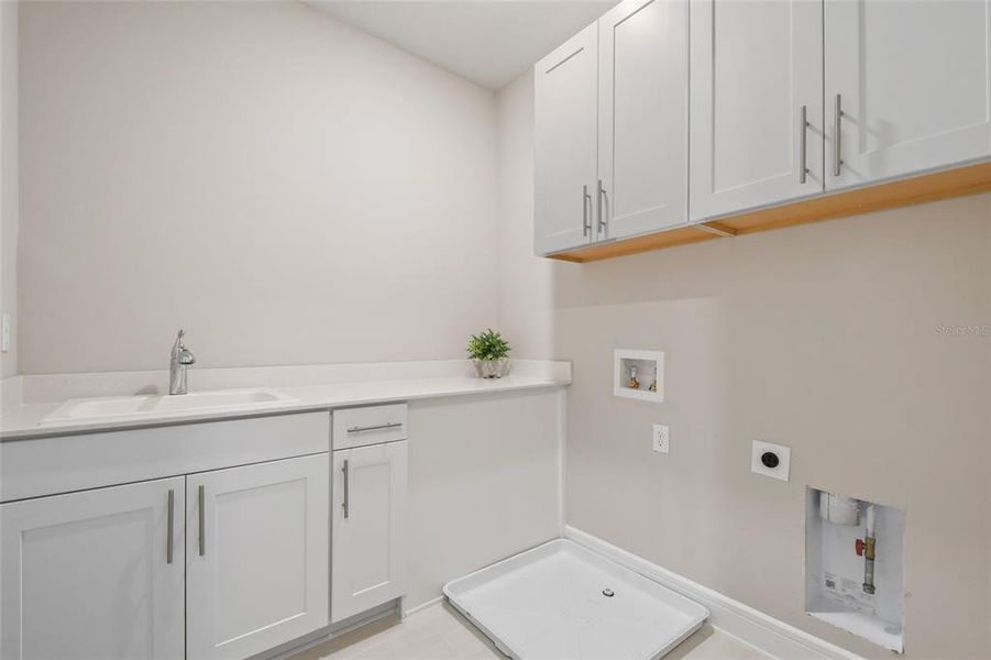 Laundry Room with Sink and Cabinets