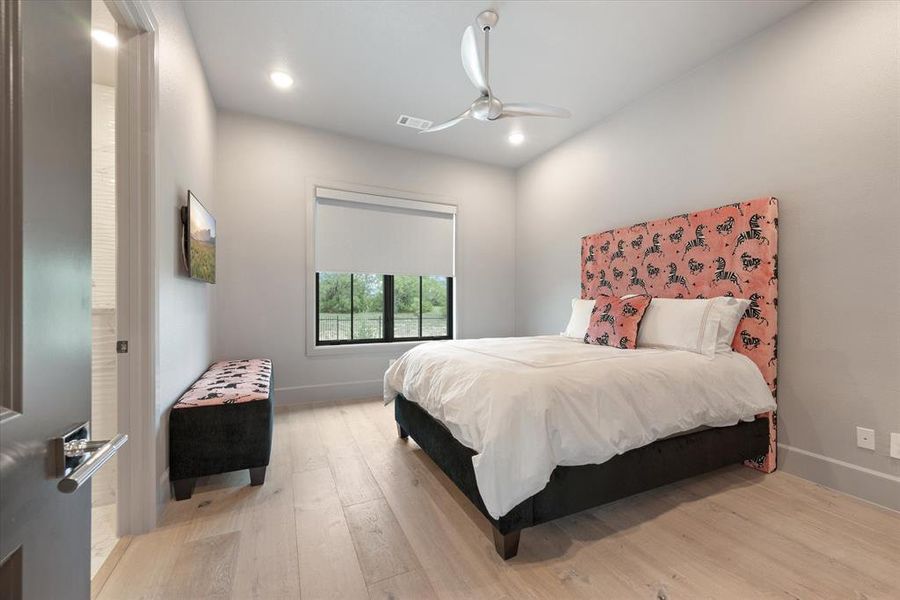 Bedroom with light wood-type flooring and ceiling fan