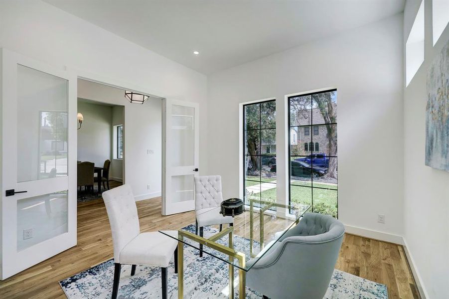 Private home office/study off of entryway with 8 ft. windows for natural light