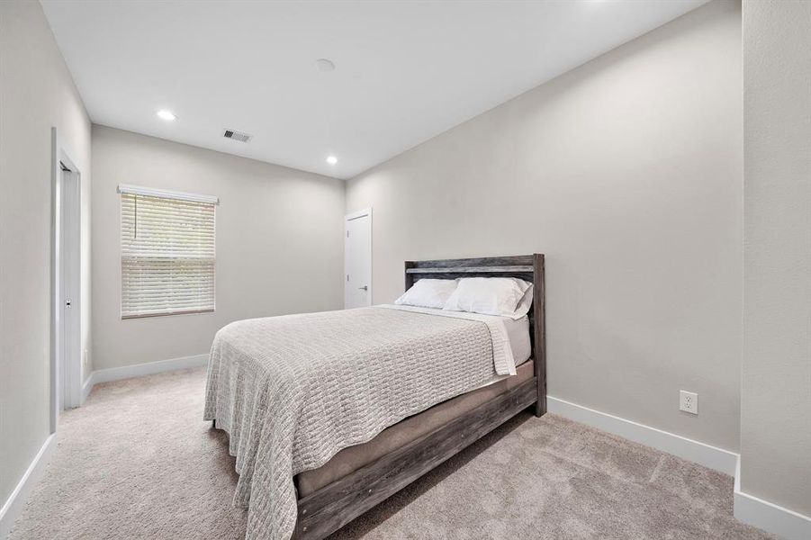 Spacious Secondary Bedroom on the second level with plush carpet, recessed lighting and natural lighting from window too!