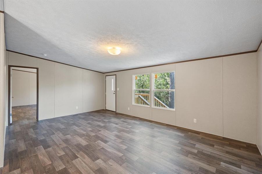 Front living room featuring laminate flooring