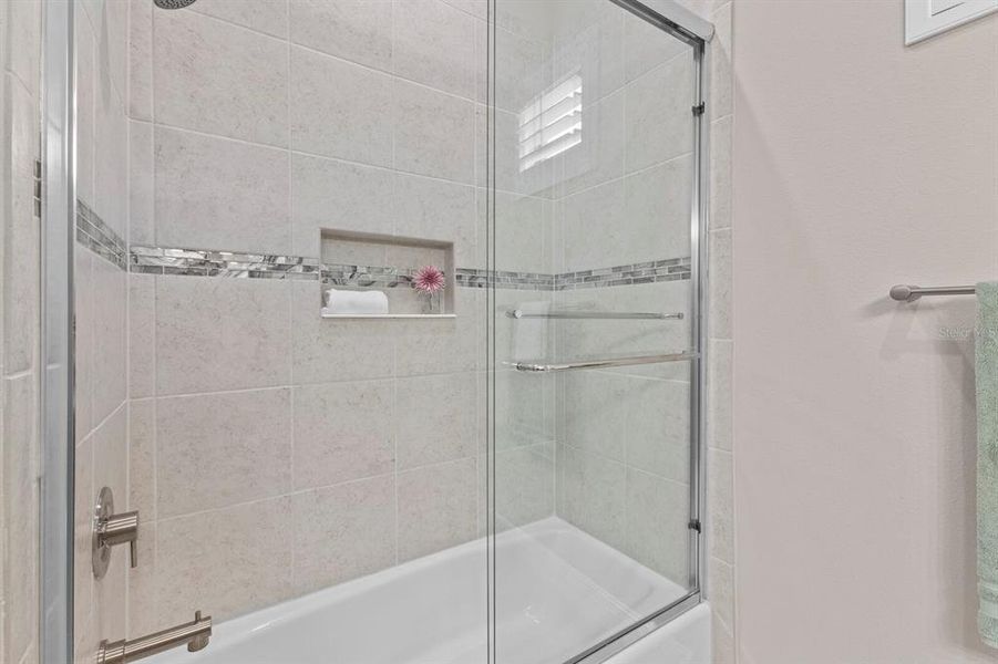 Bathroom 2 tub with glass enclosure