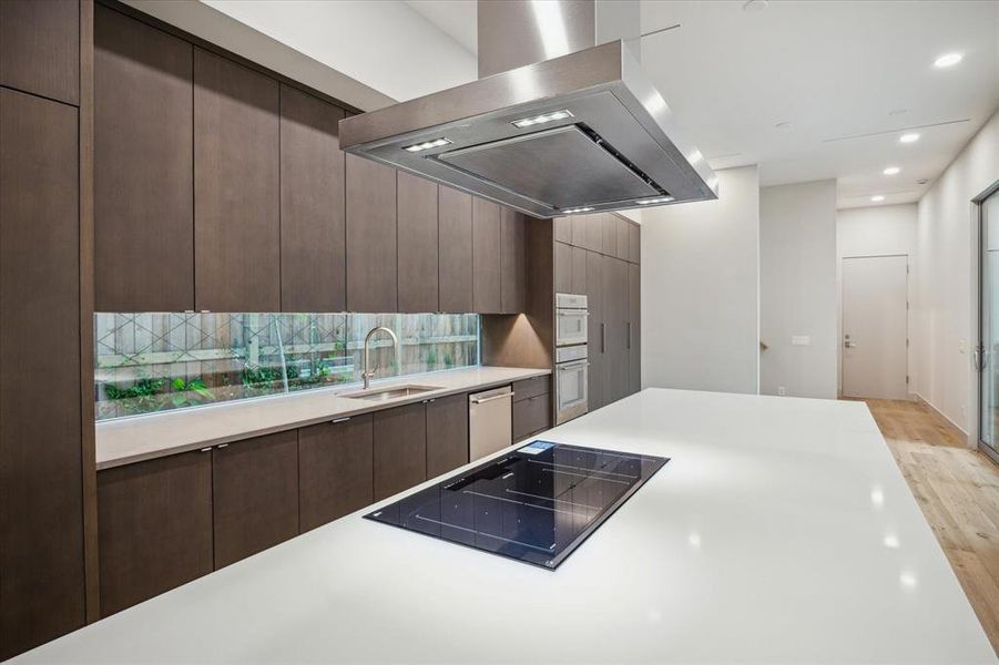 Thermadore Induction Stovetop. See the modern window backsplash.