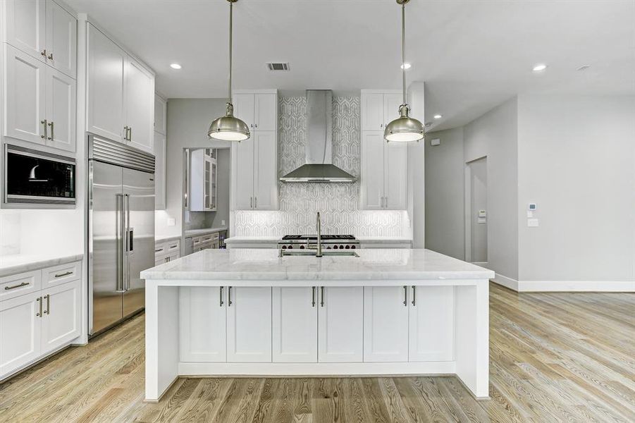 Abundance of cabinets and counterspace. All custom cabinets throughout with soft close under mount slides and soft close hinges.   Please note the lovely light fixtures and Baldwin hardware.