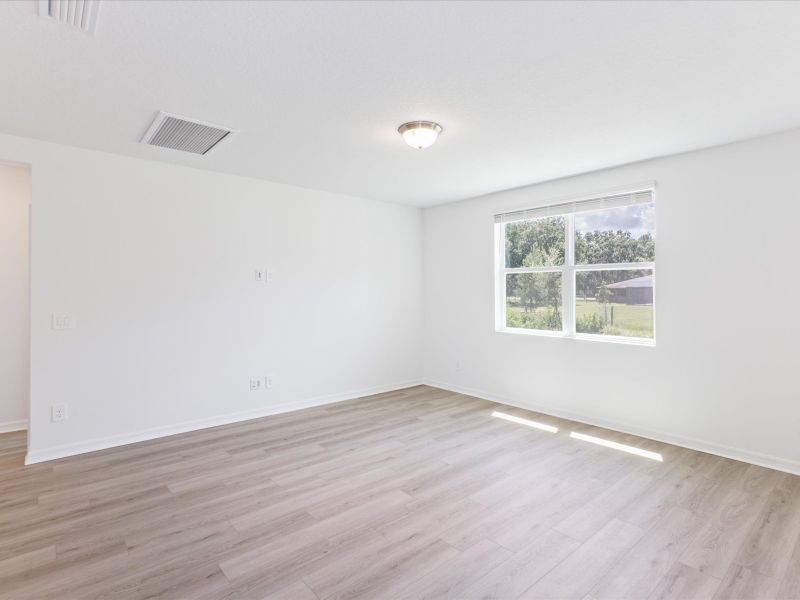 Living room in the Foxglove floorplan at 5166 Minneola Lane