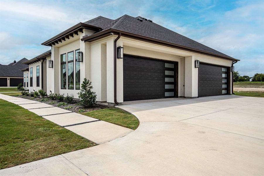 Side view of house with a 4 car garage