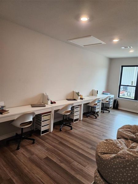 Office area with dark wood-type flooring