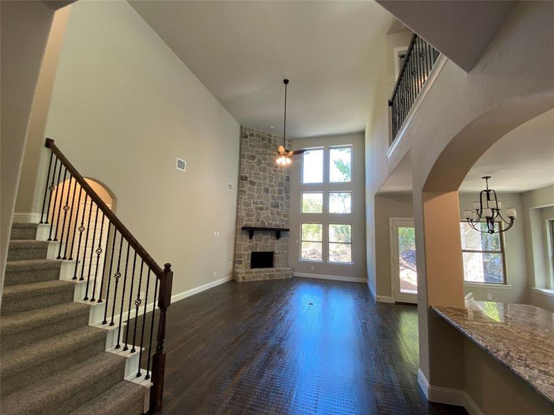 Impressive cathedral ceilings in great room with a wall of windows!