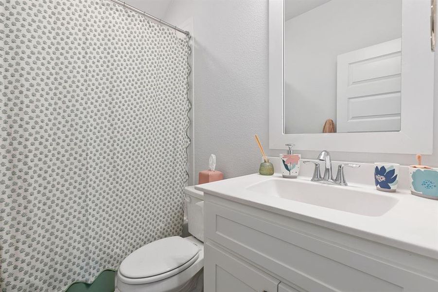 Bathroom with vanity and toilet