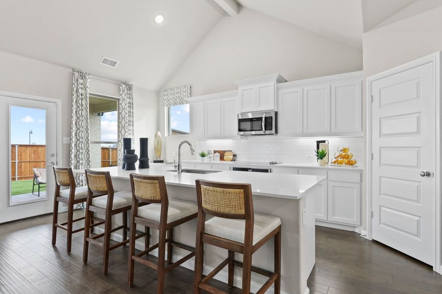 Kitchen in the Wimbledon home plan by Trophy Signature Homes – REPRESENTATIVE PHOTO