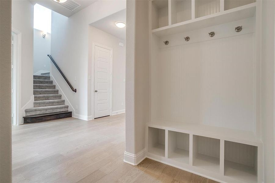 Mudroom featuring light wood-type flooring