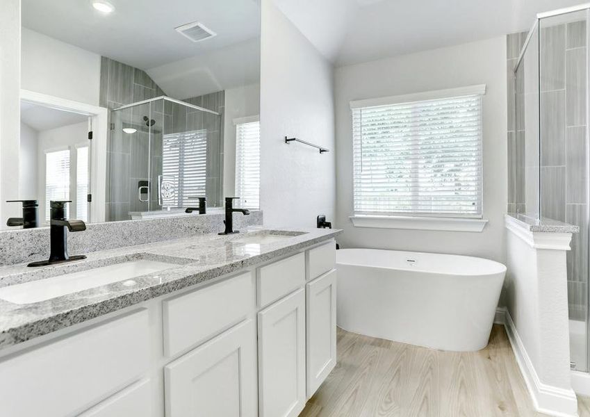 The master bathroom feels like a spa retreat with its soaking tub and walk-in shower.