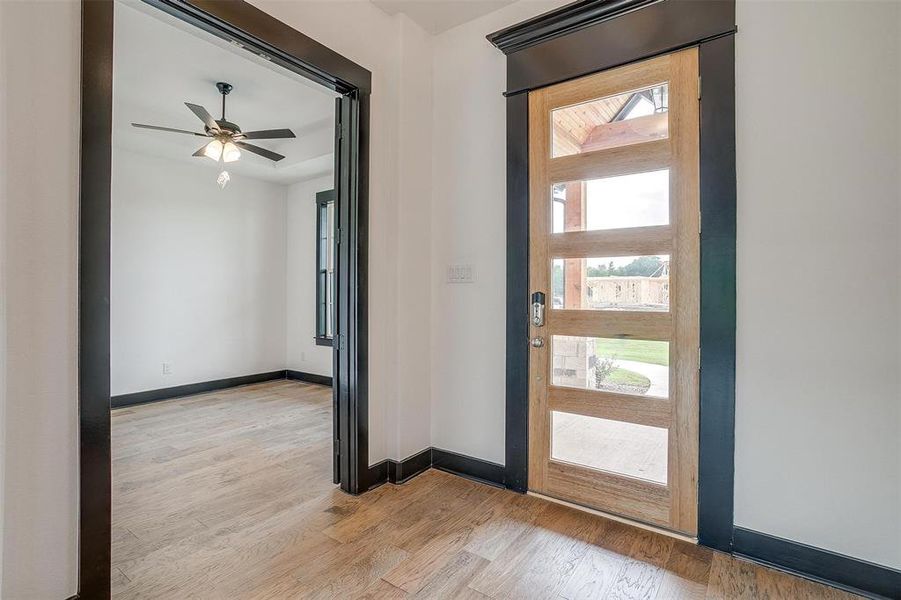 Foyer featuring ceiling fan and light hardwood / wood-style floors