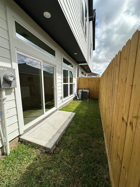 Low maintenance backyard - ideal for small pets, grilling. Can be turfed or graveled as well.