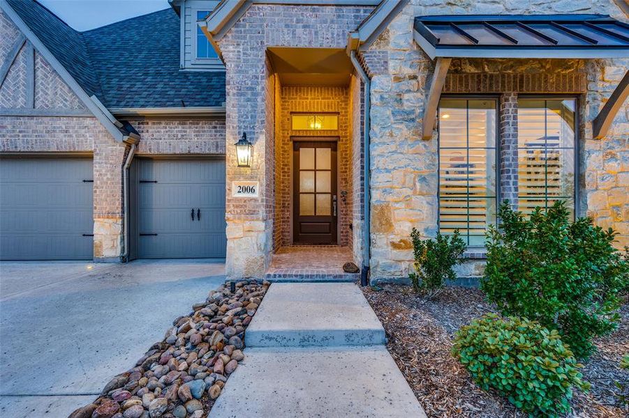 Property entrance featuring a garage