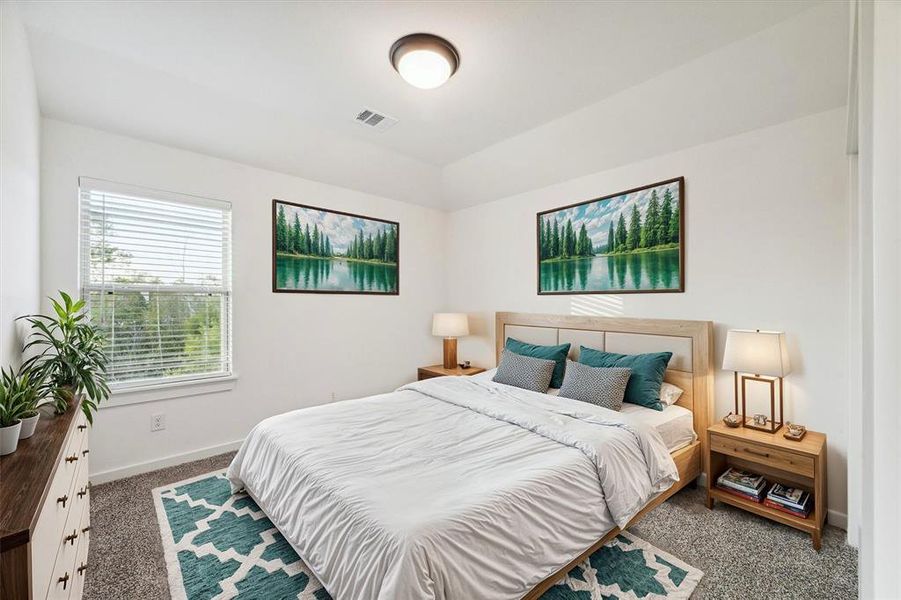 This second bedroom provides a calming ambiance, complete with scenic views that enhance the sense of tranquility. The minimalist design encourages relaxation and peaceful sleep.