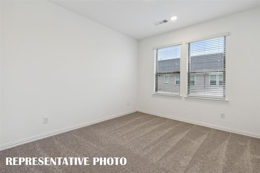 One of two nicely sized secondary bedrooms in our Tatum floor plan.  REPRESENTATIVE PHOTO