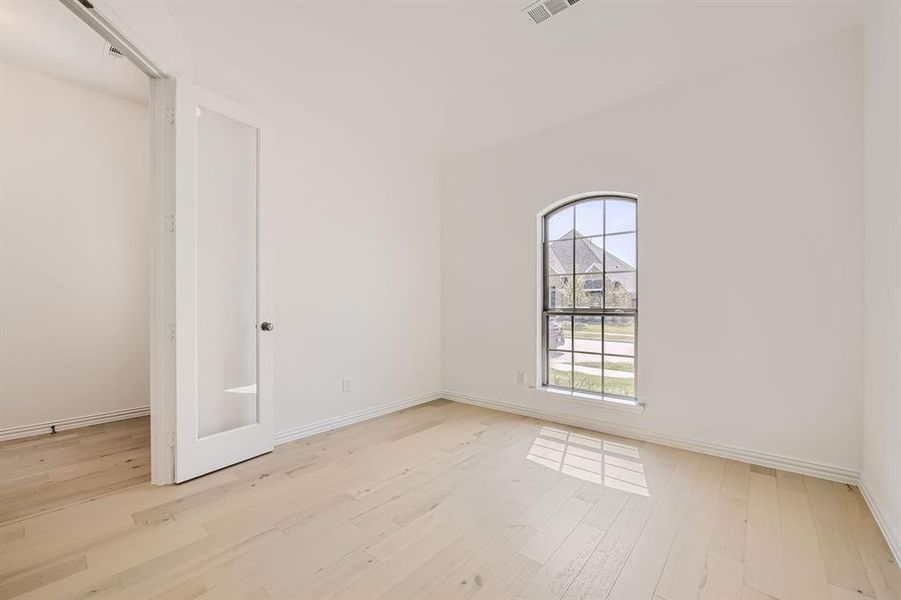 Spare room featuring light hardwood / wood-style flooring