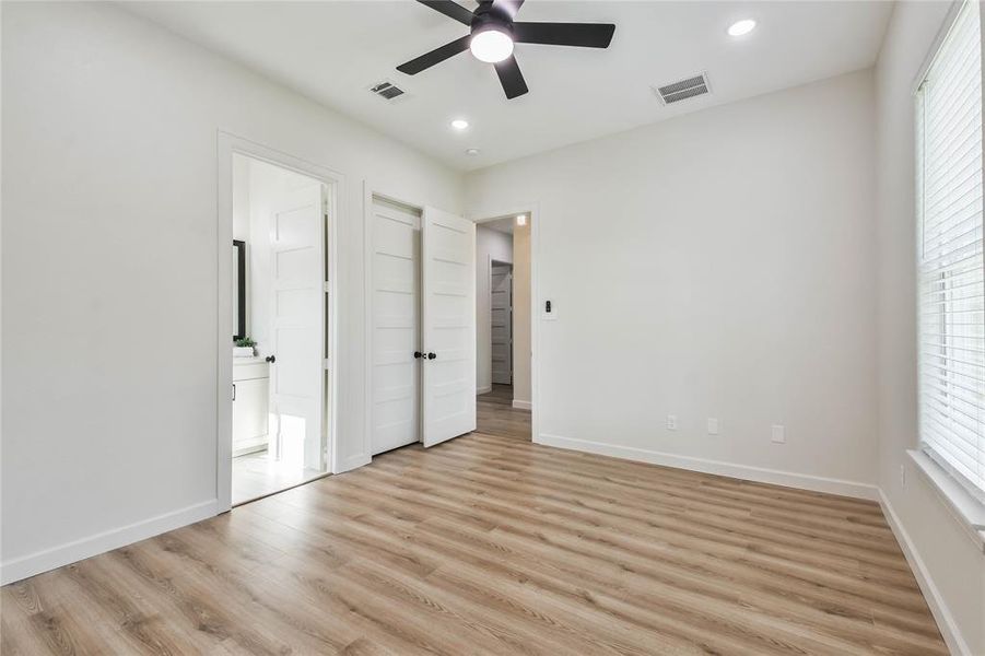 View of 4th Bedroom with adjoining bathroom, ceiling fan and large closet.