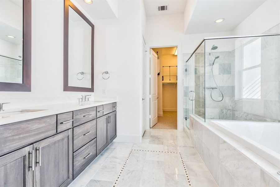 Spa-like primary bathroom with 6ft soaking tub