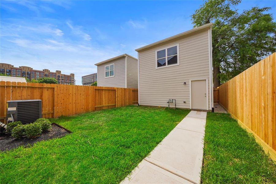 The backyard and detached garage which has the option to be built out. *SAMPLE PHOTO OF THE GIBRALTAR FLOOR PLAN* (The image may feature alternative selections and/or upgrades.)