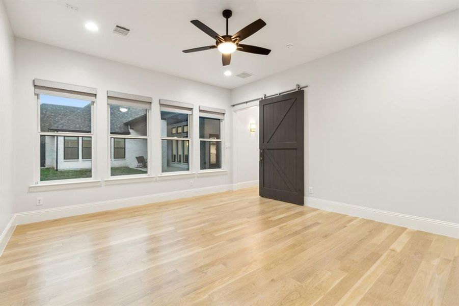 Game room with barn door could be used as media room or play room for kids!