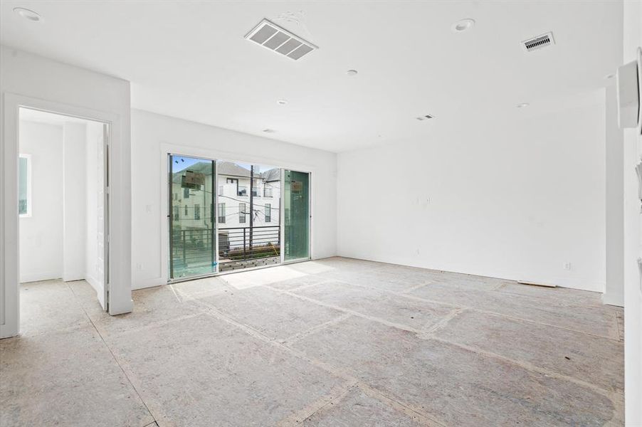 Spacious living area with sliding glass doors